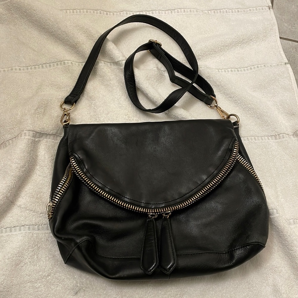 This purse is made from Italian leather and has many different compartments.